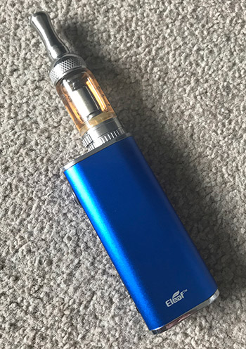Blue vape device on a textured gray background