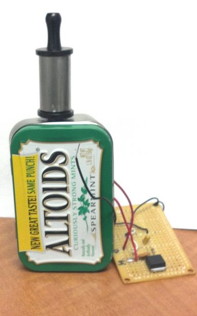 Altoids tin with electronic components attached.