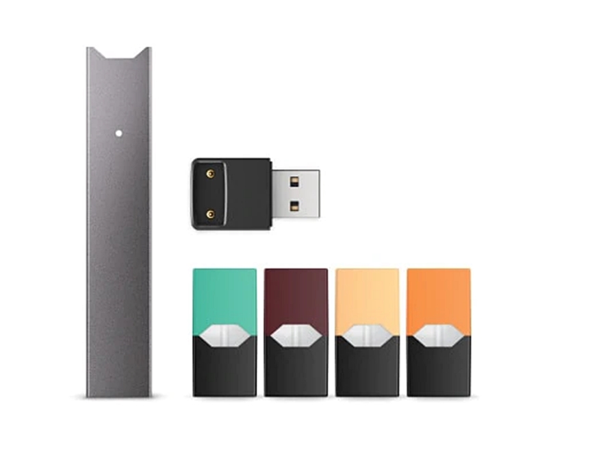 Vaping device with flavored pods and USB charger.