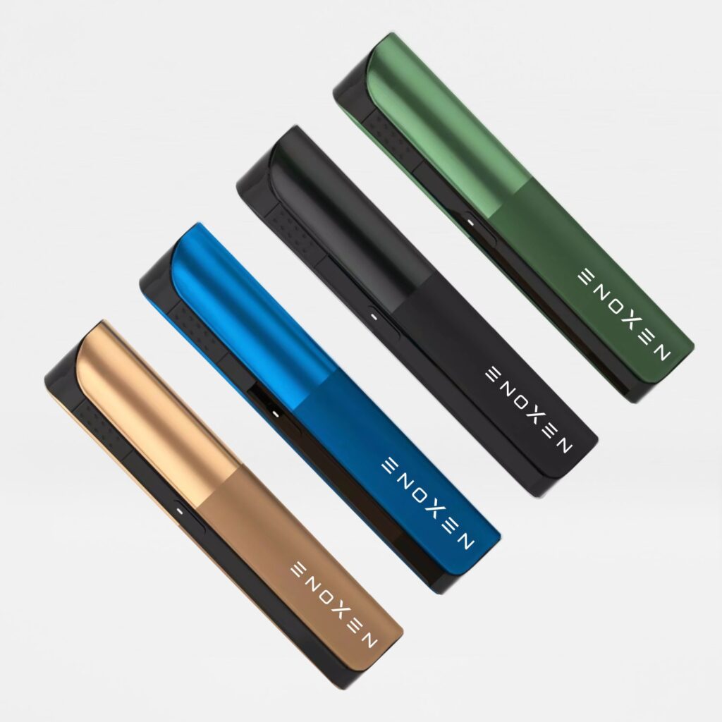 Four colored vape devices arranged in a row.