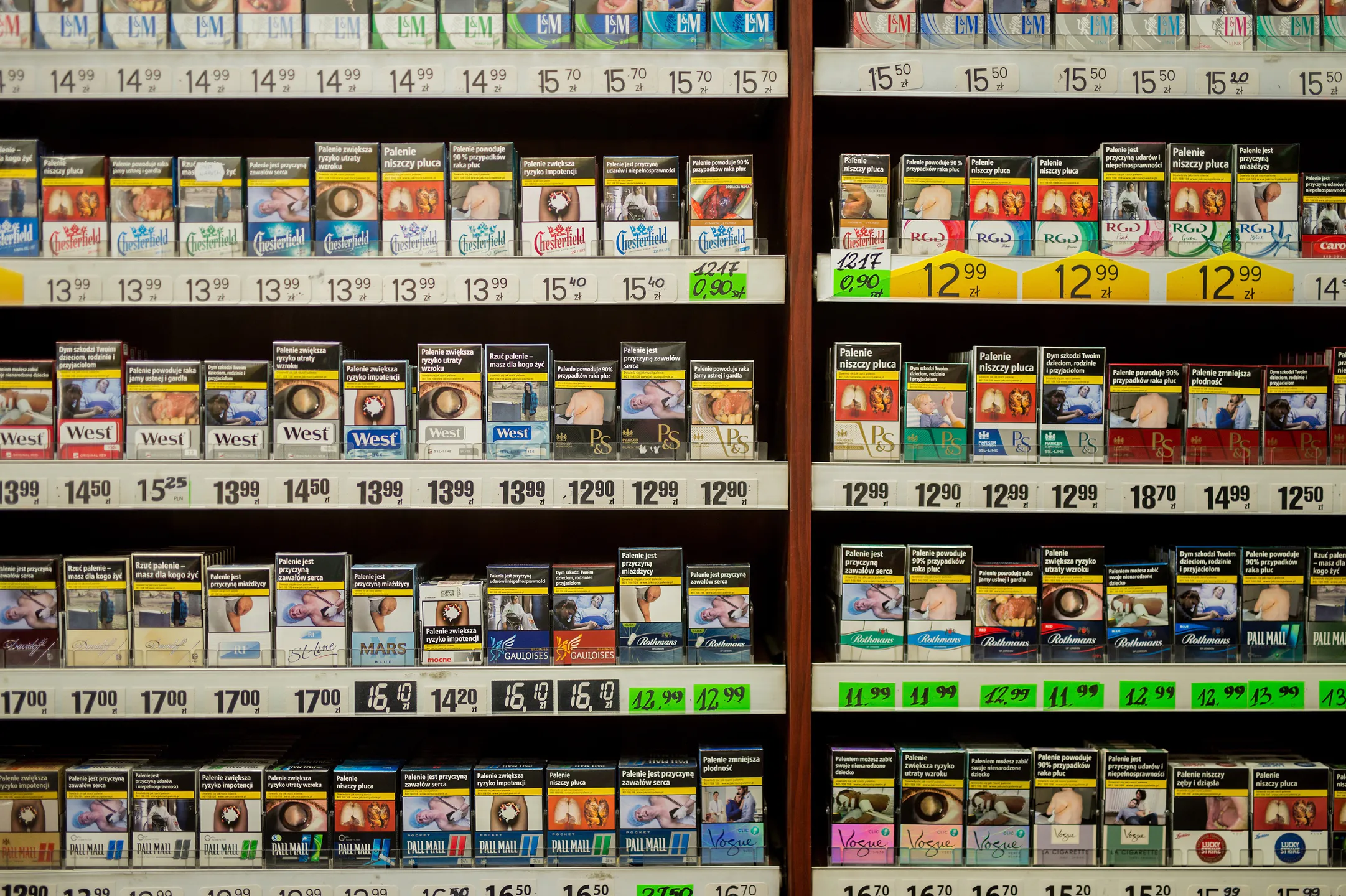 Display of various cigarette brands on shelves