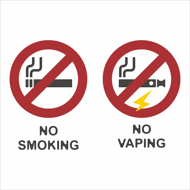 Czerwony znak zakazu z symbolem e-papierosa, oznaczający miejsca absolutnie zabronione dla vapowania.